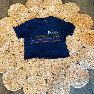 A black crop top with a Kodak graphic design